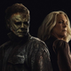 michael and laurie standing back to back